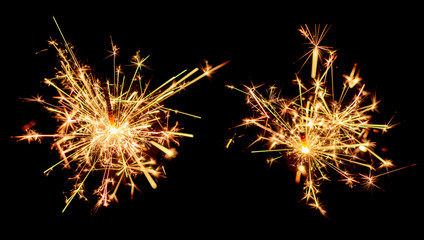 Set of Christmas sparkler burning isolated on black background.