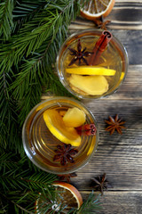 Ginger tea with lemon and spices in a glass Hot winter or autumn drink Concept of winter holidays and Christmas