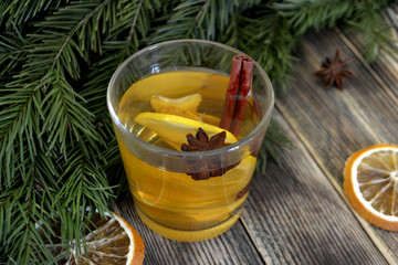 Ginger tea with lemon and spices in a glass Hot winter or autumn drink Concept of winter holidays and Christmas