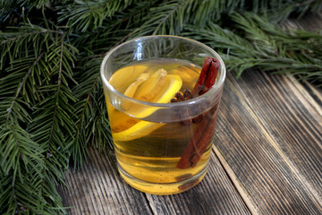 Ginger tea with lemon and spices in a glass Hot winter or autumn drink Concept of winter holidays and Christmas