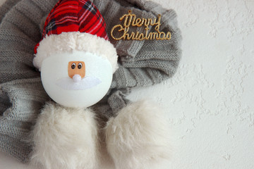 New Year ball of a snowman on a white background