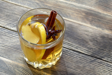 Ginger drink with lemon and spices Ginger tea on wooden table Copy space