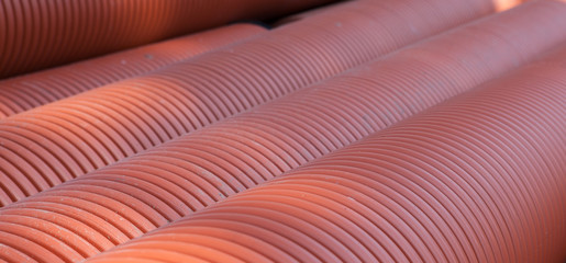Corrugated water pipes of large diameter prepared for laying, background