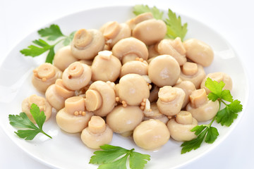 Salted mushrooms on a plate. Restaurant dish.