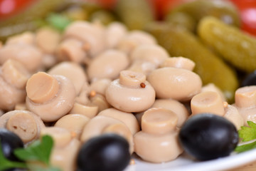 Pickles in assortment on a plate. Restaurant dish.