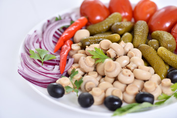 Pickles in assortment on a plate. Restaurant dish.