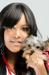 Young African American Woman  Holding Small Dog