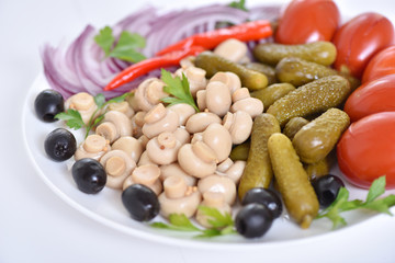 Pickles in assortment on a plate. Restaurant dish.