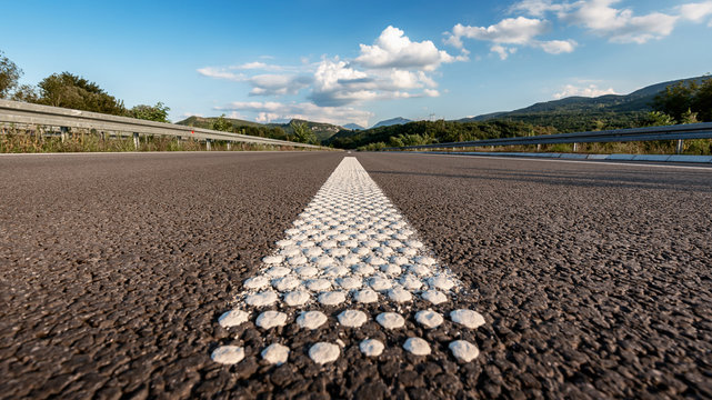 Empty Asphalt highway road with close up markings