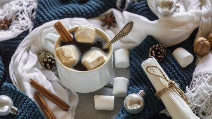 A cup of coffee and marshmallow in the New Year table setting