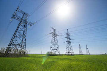 power line summer landscape / passing overhead electricity wire of the support carrying the light and the heat in the house