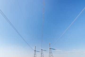 power line summer landscape / passing overhead electricity wire of the support carrying the light and the heat in the house