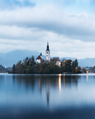 Evening autumn view of Bled lake in Julian Alps, Slovenia. Pilgrimage church of the Assumption of Maria on a foreground. Landscape photography