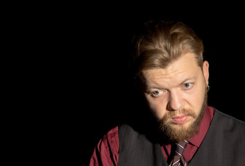 man with a beard on a black background