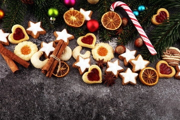 Decoration with christmas cookies. Typical cinnamon stars with fruits and nuts