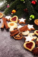 Decoration with christmas cookies. Typical cinnamon stars with fruits and nuts