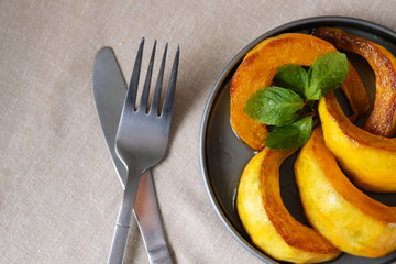 pumpkin slices with honey. Pumpkin on a plate, top view