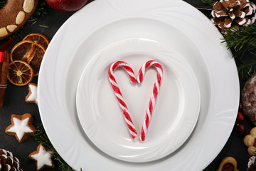 Festive table setting for xmas with fork, knife, nuts and apples a christmas dish concept