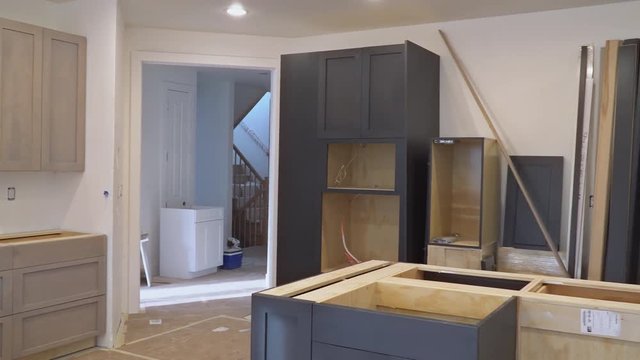 Custom kitchen cabinets in various stages of installation base for Installation of kitchen cabinets