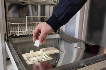  Detergents, tablets on dishwasher background,