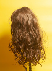 Naklejka premium Woman long curly hairs wig
