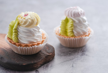 cakes with berries raspberries and blackberries. Posted on a wooden table