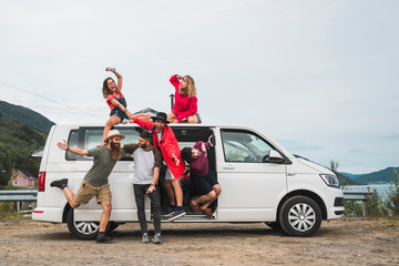 Traveling friends having fun taking a break on their journey through Norwegian Lapland