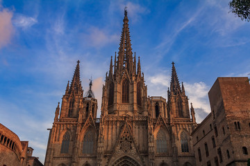 Fototapeta na wymiar View of the gothic Cathedral of the Holy Cross and Saint Eulalia, or Barcelona Cathedral, seat of the Archbishop of Barcelona, Spain at sunset