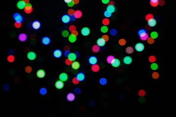 festive abstract defocused led lights on black background