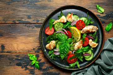 Vegetable salad with fried chicken.Top view with copy space.
