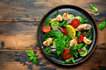 Vegetable salad with fried chicken.Top view with copy space.