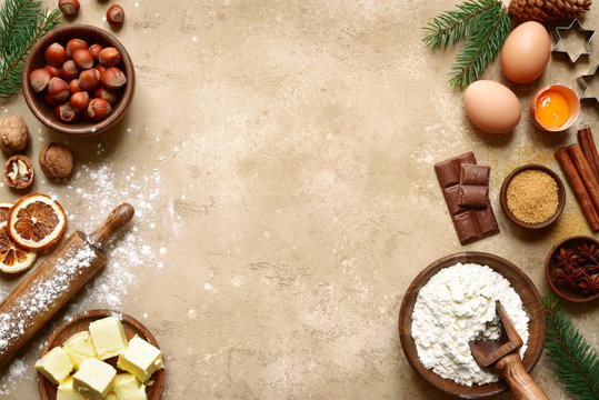 Rustic christmas baking background with ingredients for making cookies or cake.Top view with space for text.
