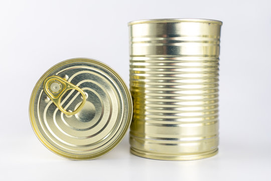 Can with meat dish on a white table. Canned food with a long shelf life.