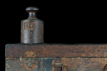 A kilogram weight used for weighing a given quantity in the store. Weights of one kilogram and two kilograms.