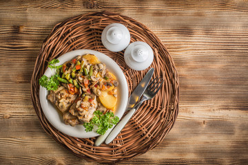 Fillet of chicken legs with stewed vegetables.