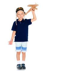 Little boy with a wooden plane.