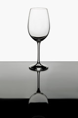 empty wine glass on a colorless background