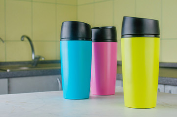 Three thermomugs on the table in the kitchen