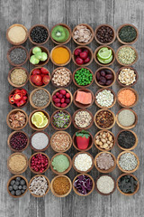 Large super food selection with fish, fruit, vegetables, seeds, grains, cereals, coffee, tea, nuts, legumes, herbs and spices. High in antioxidants, anthocyanins, vitamins and dietary fibre.