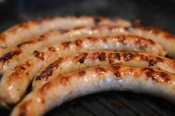 Delicious fried sausages (closeup)