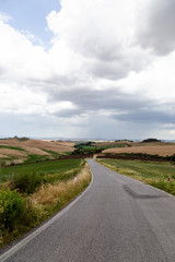 Fototapeta premium Road through countryside in Tuscany, Italy