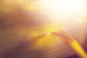 Golden book with orange ribbon bookmark