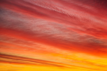 Beautiful sunset or sunrise background.  Multicolored red orange sky with clouds