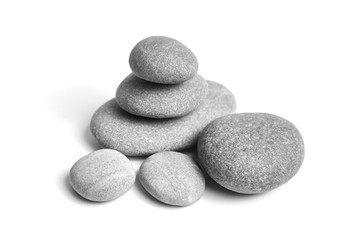 Group of smooth grey stones. Sea pebble. Stacked pebbles isolated on white background