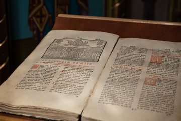 Old Christian manuscript written in Cyrillic on church pulpit.