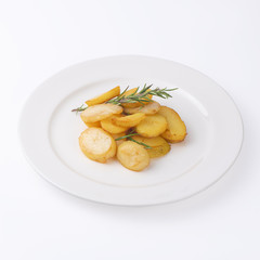Crunchy fried potato slices with fresh rosemary isolated on white background