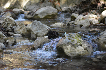 Fototapeta na wymiar Water Flowing Over Rocks