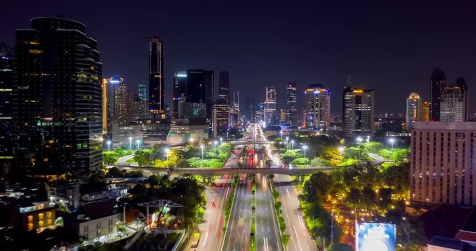 JAKARTA, Indonesia - November 21, 2018: Beautiful hyperlapse of vehicle light trails on freeway at Semanggi highway intersection at night. Shot in 4k resolution