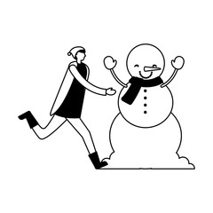 man with winter clothes and snowman