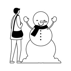 man with winter clothes and snowman